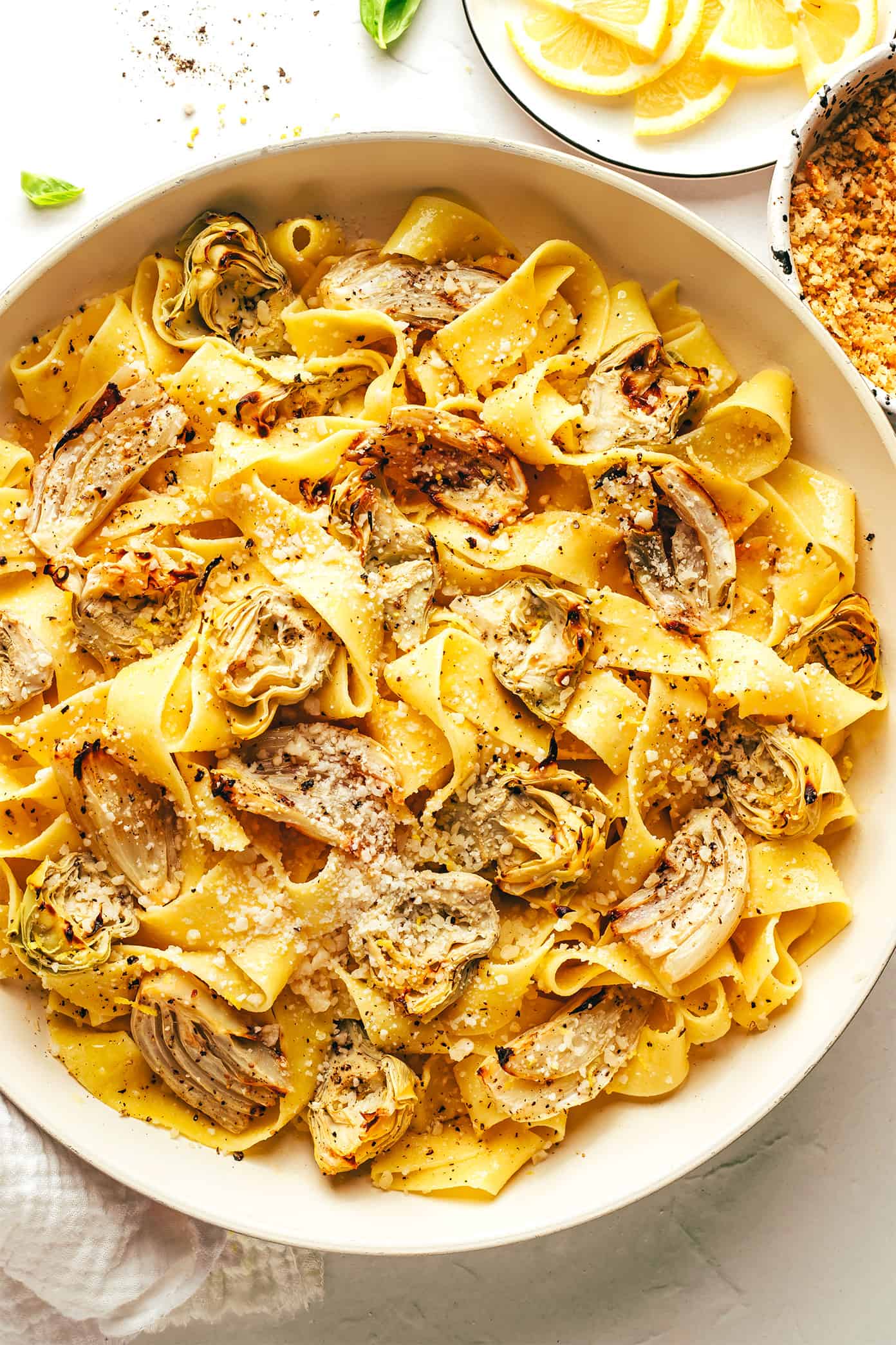 This lemon brown butter pasta is tossed with roasted artichokes and fennel and sprinkled with the most delicious garlic toasted breadcrumbs. Serve it up with parmesan and fresh basil for a simple vegetarian dinner, or add in an extra protein (shrimp, chicken, sausage, etc) if you'd like! | gimmesomeoven.com Lemon Brown Butter Pasta in Pan with Roasted Artichokes and Fennel and Garlic Breadcrumbs