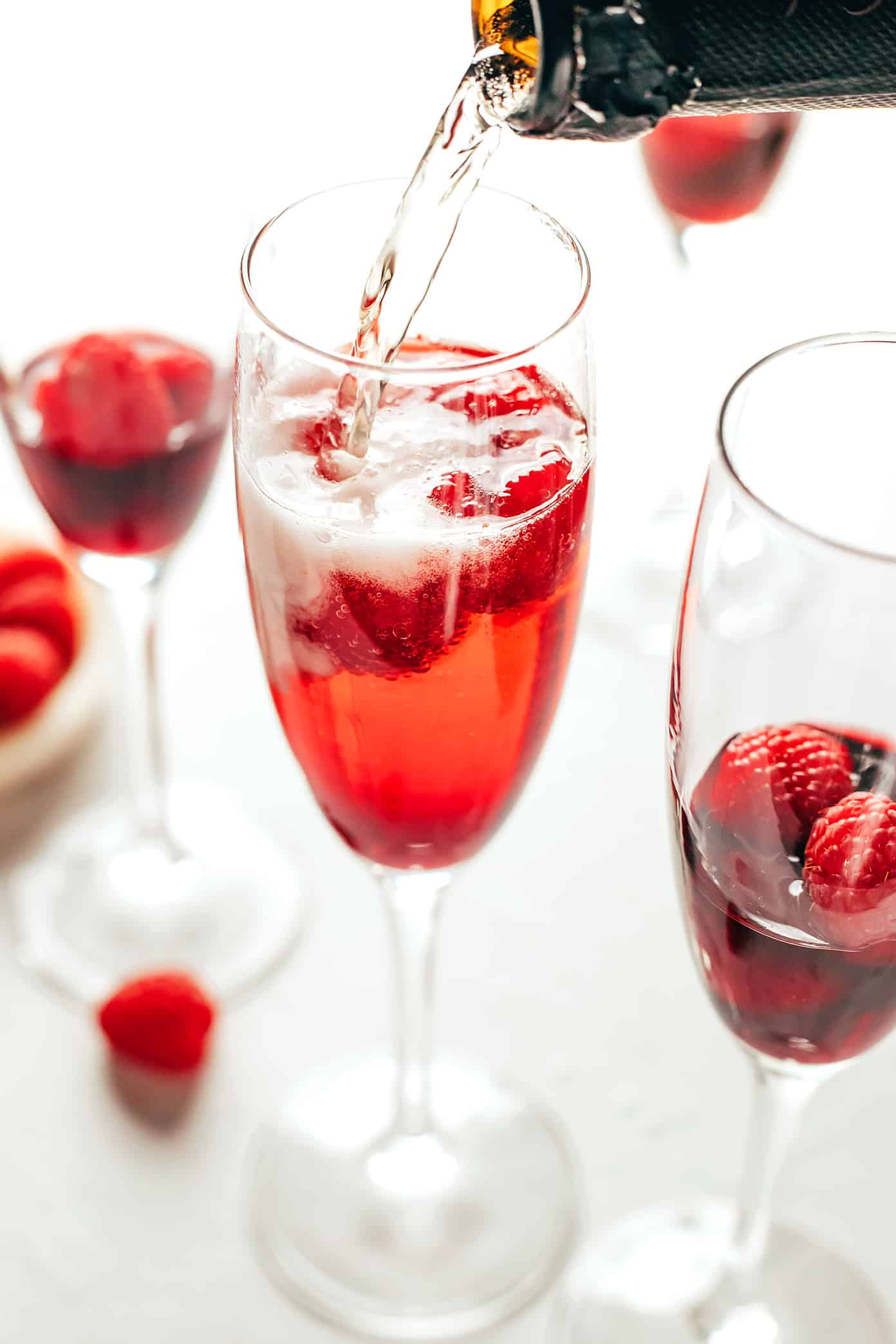 This classic kir royale cocktail recipe is easy to make with dry sparkling wine (such as Champagne, cava or prosecco), crème de cassis (blackcurrant liqueur) and your choice of berries for garnish. It's a vibrant, bubbly, refreshing drink that's perfect for summertime! | gimmesomeoven.com Kir Royale