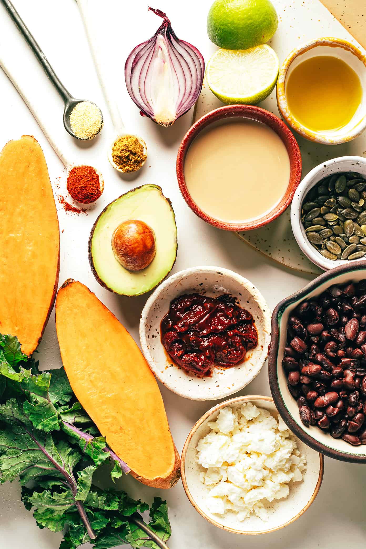 This Tex-Mex inspired kale salad is loaded up with zesty roasted sweet potatoes, avocado, pepitas, red onion, black beans, cotija or feta cheese, and lots of fresh cilantro. Then it's drizzled with a heavenly 4-ingredient chipotle lime tahini dressing, which you are going to LOVE. Feel free to add in a protein (chicken, shrimp, steak, etc) if you'd like, or skip the cheese and turn this vegetarian recipe vegan. It's healthy, naturally gluten-free and always so delicious! | gimmesomeoven.com Sweet Potato Avocado Salad Ingredients