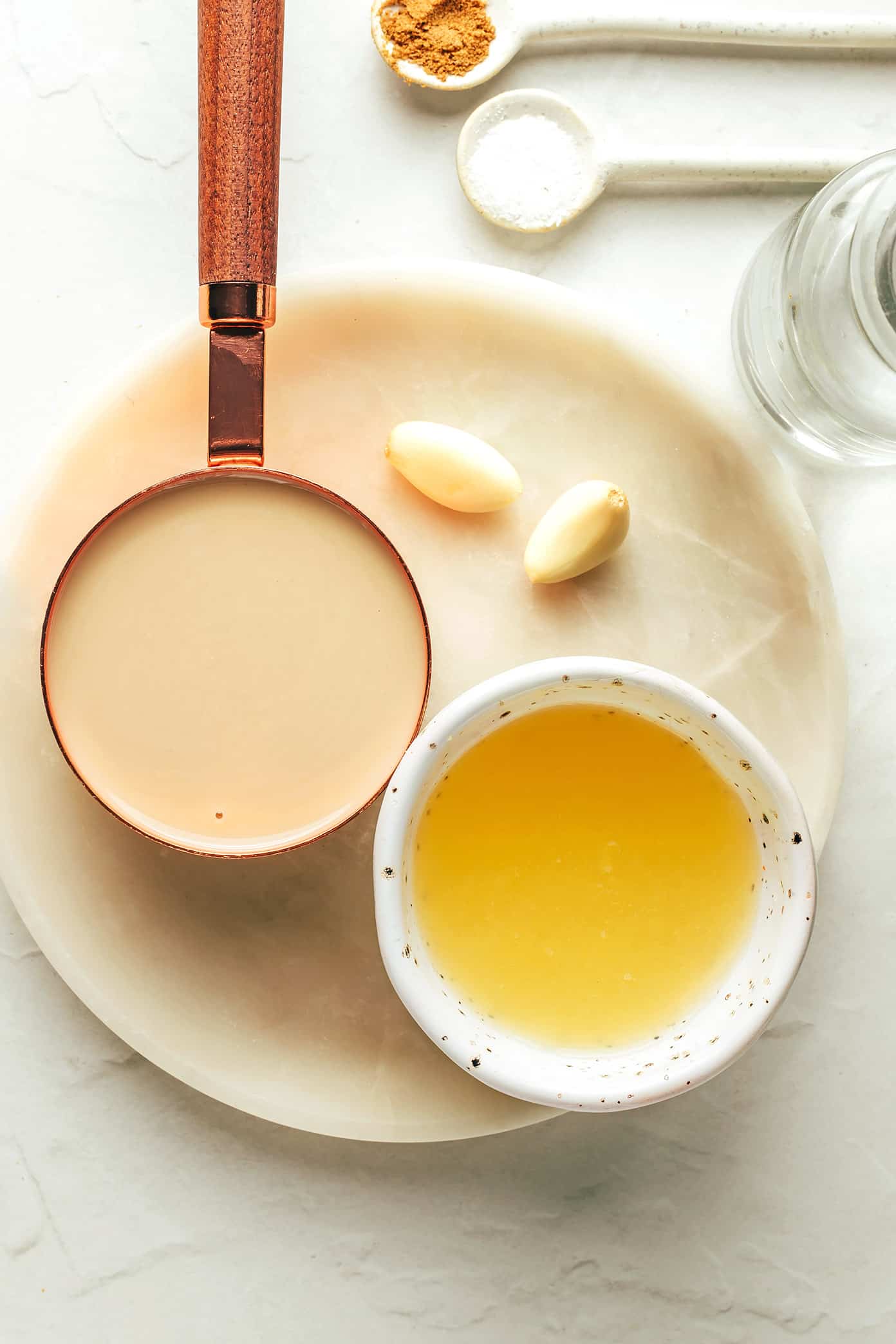 This homemade tahini sauce recipe is quick and easy to make with 5 ingredients and tastes amazing with everything from falafel to roasted veggies, grilled meats, wraps, salads and more. It's naturally gluten free and vegan, and easy to customize with extra herbs, spices or sweetener if you'd like. | gimmesomeoven.com Tahini sauce ingredients