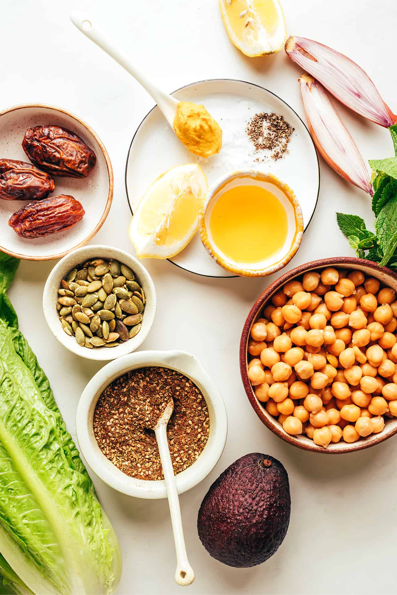 This vibrant green salad is loaded up with chickpeas, Medjool dates, avocado, pepitas, loads of fresh mint, and tossed with a lemony za'atar shallot vinaigrette. It's naturally vegan and gluten-free, but feel free to add a protein such as chicken, steak, shrimp or salmon if you'd like. So fresh and delicious! | gimmesomeoven.com Salad Ingredients