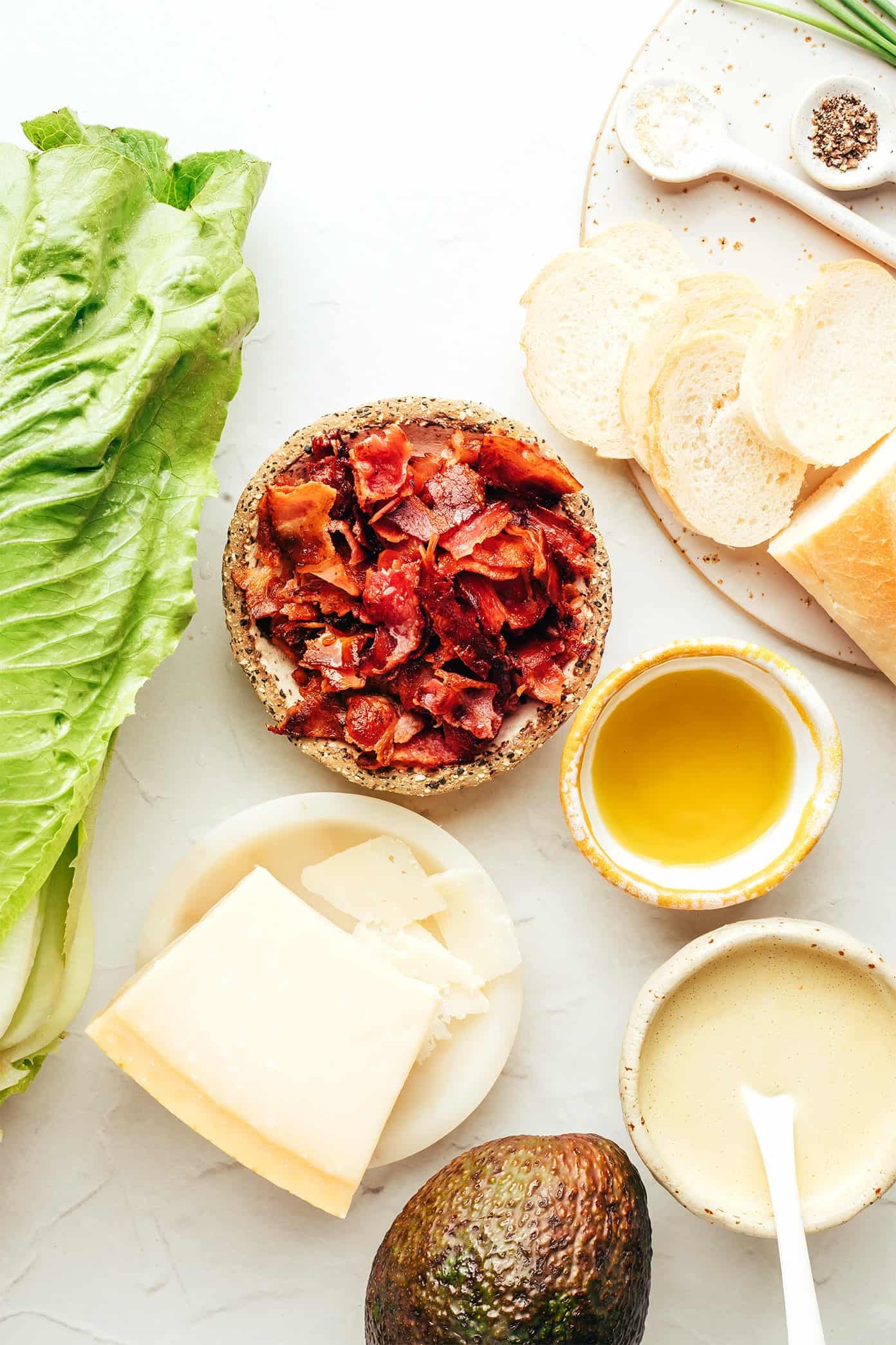 Classic Caesar salad is leveled up with crispy bacon, avocado, rosemary, chives, shaved Parmesan and garlicky croutons. So delicious! | gimmesomeoven.com Bacon Avocado Caesar Salad Ingredients