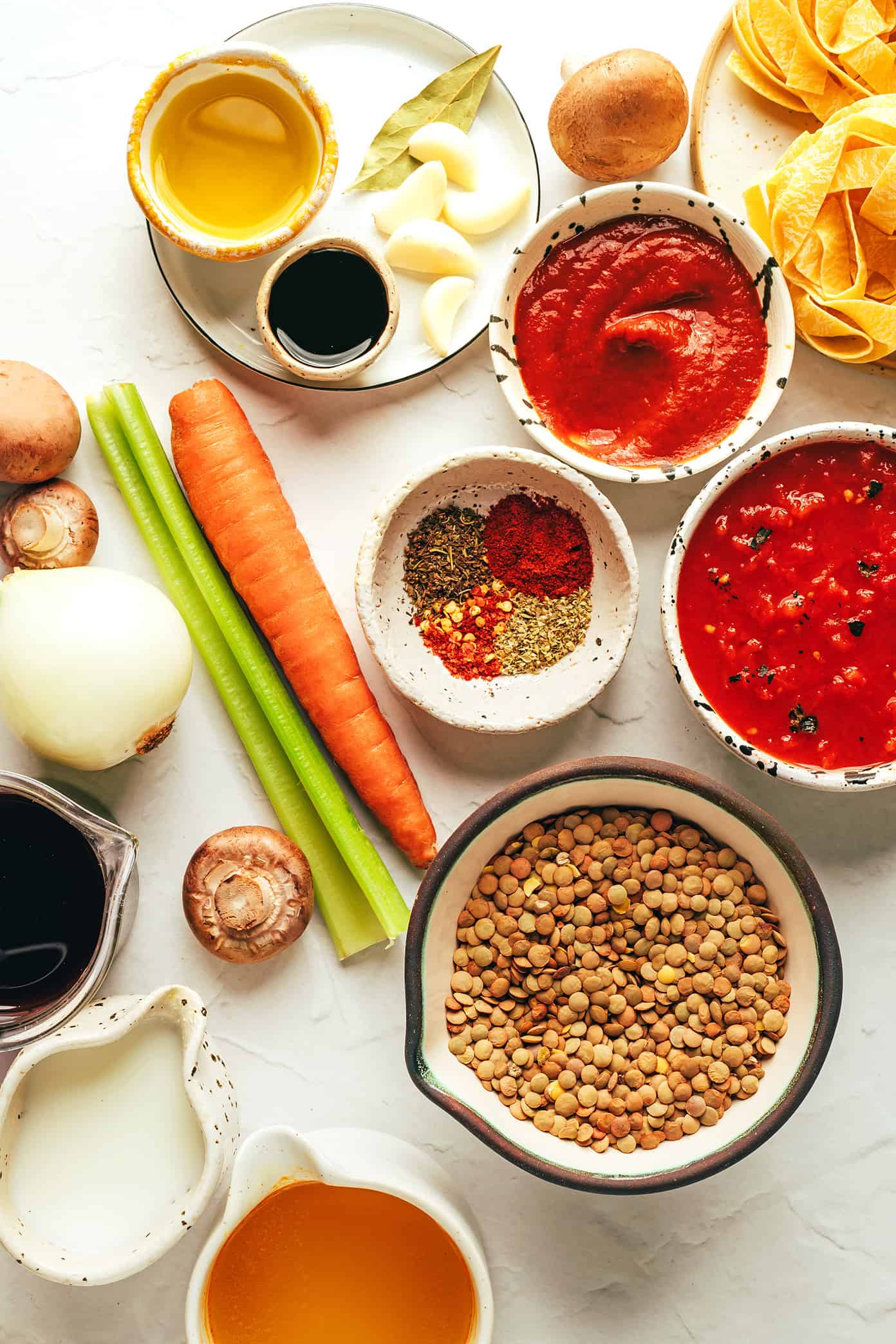 This hearty lentil bolognese recipe is naturally gluten-free, vegetarian and vegan and simmered with a garlicky mushroom-herb tomato sauce. Feel free to serve for dinner with pasta, gnocchi, mashed potatoes, polenta or whatever sounds good! | gimmesomeoven.com Vegetarian bolognese ingredients
