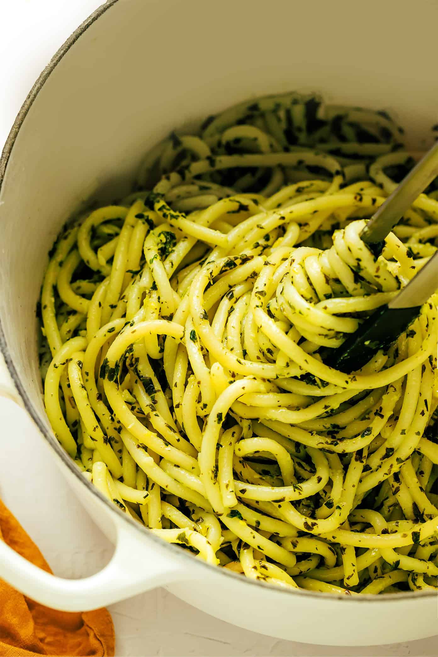 All you need are 6 simple ingredients to make a delicious batch of this lemon basil butter pasta dinner in less than 30 minutes! Feel free to add an extra protein (chicken, shrimp, sausage) or some extra veggies if you'd like too. | gimmesomeoven.com Tossing pasta with basil butter