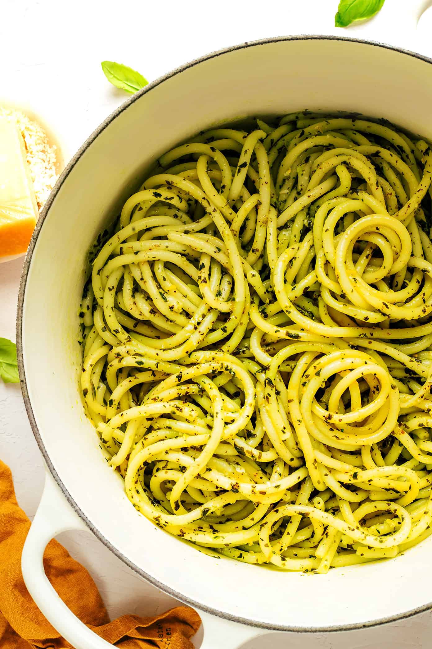 All you need are 6 simple ingredients to make a delicious batch of this lemon basil butter pasta dinner in less than 30 minutes! Feel free to add an extra protein (chicken, shrimp, sausage) or some extra veggies if you'd like too. | gimmesomeoven.com Lemon basil butter pasta in pot made with bucatini