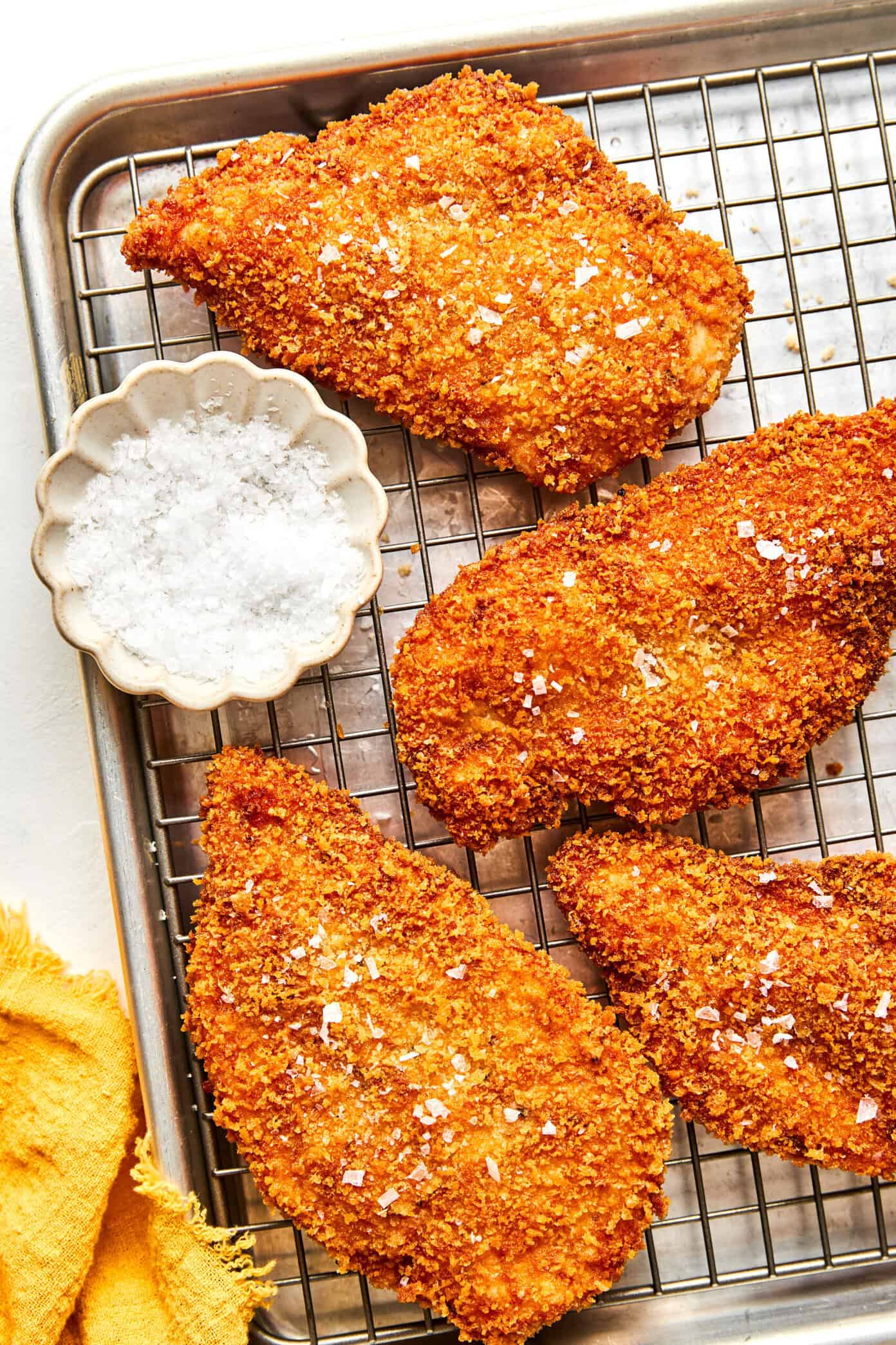 crispy chicken milanese with arugula salad closeup