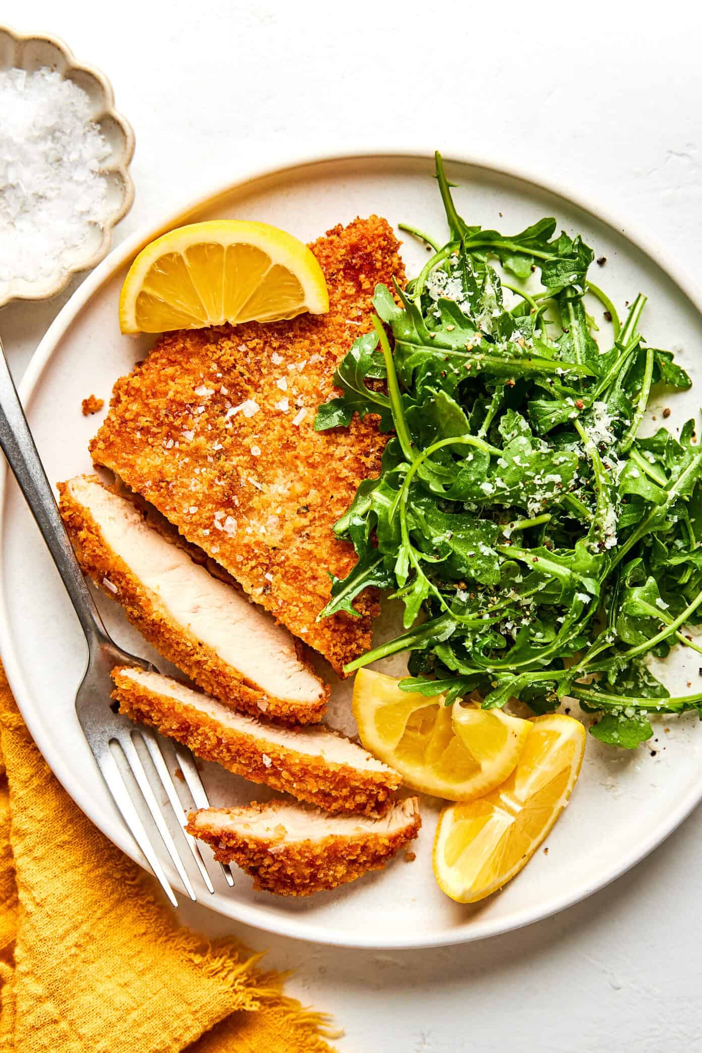 crispy chicken milanese with arugula salad