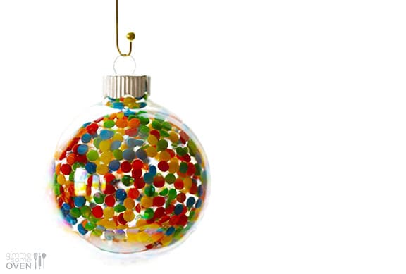 DIY Sprinkles Ornaments | gimmesomeoven.com/style #christmas #diy #ornament #sprinkles These DIY Sprinkles Ornaments are easy to make and customize with your favorite colors of sprinkles. The perfect homemade decor for your Christmas tree this year! | Gimme Some Oven