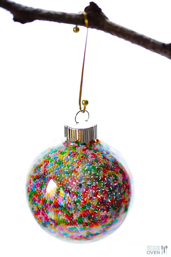 DIY Sprinkles Ornaments | gimmesomeoven.com/style #christmas #diy #ornament #sprinkles These DIY Sprinkles Ornaments are easy to make and customize with your favorite colors of sprinkles. The perfect homemade decor for your Christmas tree this year! | Gimme Some Oven