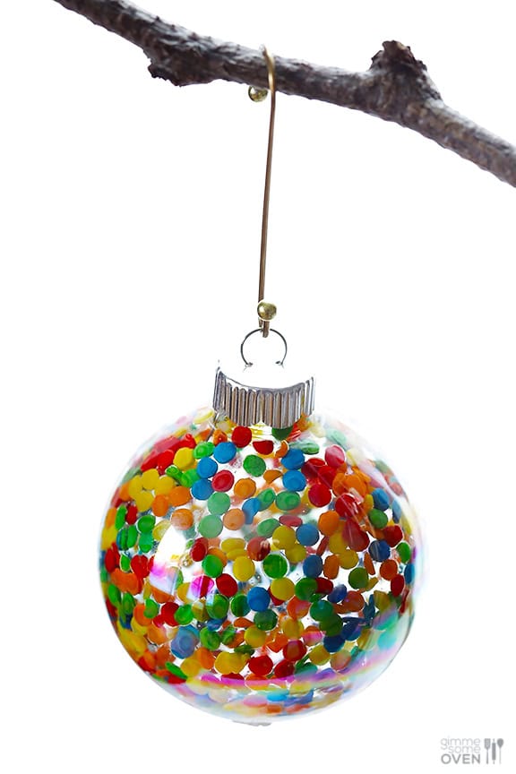 DIY Sprinkles Ornaments | gimmesomeoven.com/style #christmas #diy #ornament #sprinkles These DIY Sprinkles Ornaments are easy to make and customize with your favorite colors of sprinkles. The perfect homemade decor for your Christmas tree this year! | Gimme Some Oven