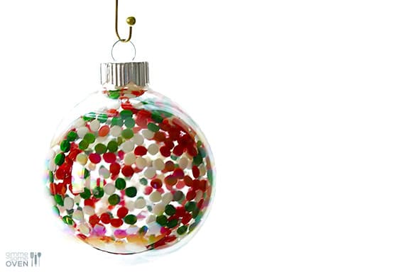 DIY Sprinkles Ornaments | gimmesomeoven.com/style #christmas #diy #ornament #sprinkles These DIY Sprinkles Ornaments are easy to make and customize with your favorite colors of sprinkles. The perfect homemade decor for your Christmas tree this year! | Gimme Some Oven