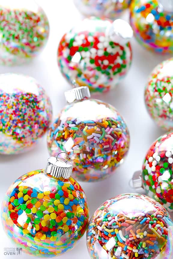DIY Sprinkles Ornaments | gimmesomeoven.com/style #christmas #diy #ornament #sprinkles These DIY Sprinkles Ornaments are easy to make and customize with your favorite colors of sprinkles. The perfect homemade decor for your Christmas tree this year! | Gimme Some Oven
